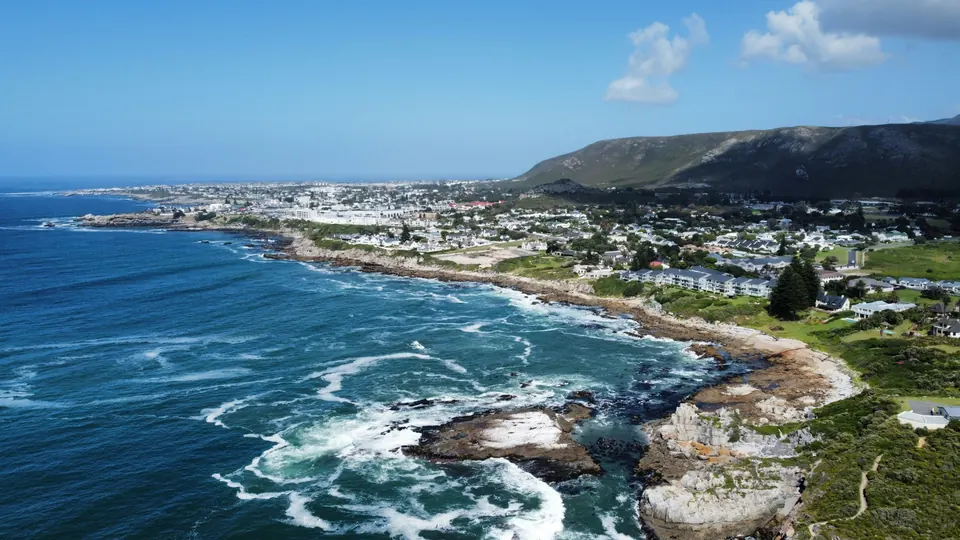 Aerial view of the rocky coastline and open sea at Hermanus, Walker Bay.